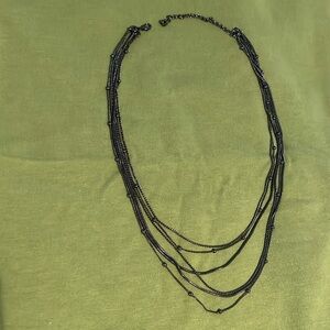 Black graduated chains with beads necklace